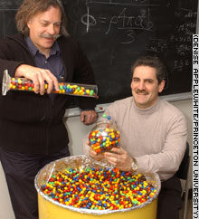 Professors Paul Chaikin, left, and Salvatore Torquato used M&M candies to reveal fundamental principles governing the random packing of particles.