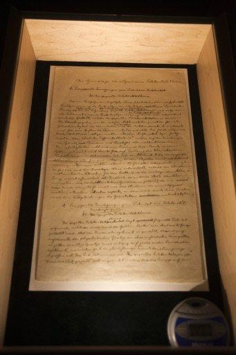 A page from the original manuscriptx of Albert Einstein&#039;s General Theory of Relativity is displayed during an exhibition at the Israeli Academy of Sciences and Humanities in Jerusalem. In a darkened room in Jerusalem, the world has been given a rare glimpse into the mind which unlocked the secrets of the universe.