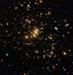 Image of the rich galaxy cluster, catalogued as Cl 0024+17, allowing astronomers to probe the distribution of dark matter in space.