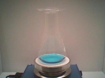 Methanol being heated in an Erlenmeyer flask