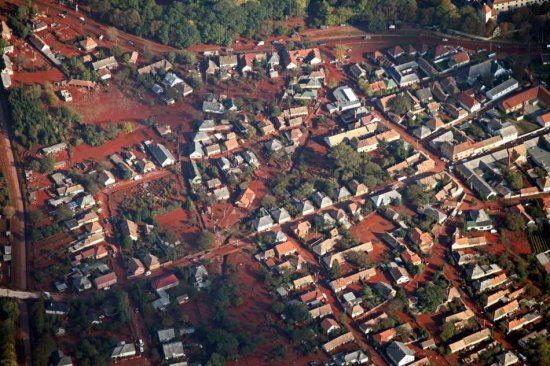 A handout picture released by Greenpeace on 08 October 2010 shows an aerial view of the toxic Hungarian flood, covering fields, streets, canals and entire villages. The toxic Hungarian sludge flood was caused by the rupture of a red sludge reservoir at an alumina plant in western Hungary and has affected seven towns near Ajkai, 160 km southwest of Budapest, Hungary. The flood of toxic is responsible for six missing people and 120 are injured. This sludge is highly toxic and contains a mixture of heavy metals.  EPA/PETER SOMOGYI-TOTH - HANDOUT