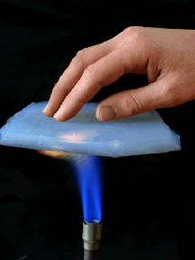 Aerogel protecting hand from heat of bunsen burner