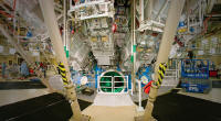 Workers on the NIF target bay floor just outside the target chamber