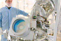 A technician inspects the final optics inspection (FODI) system for the NIF. When the FODI is extended into the 10-meter diameter target chamber from a diagnostic instrument manipulator, it can produce images of all 192 beamline final optics assemblies.