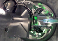 The target positioner and target alignment system precisely locate a target in the NIF target chamber. 